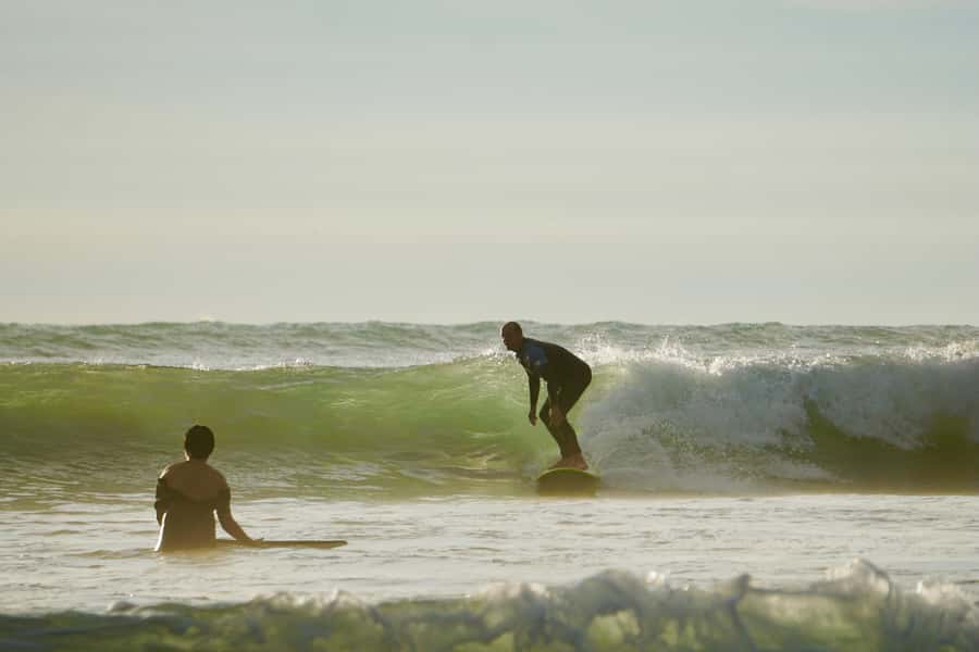 Auckland: Group Surfing Lesson with Muriwai Surf School - Equipment included, and what you still need
