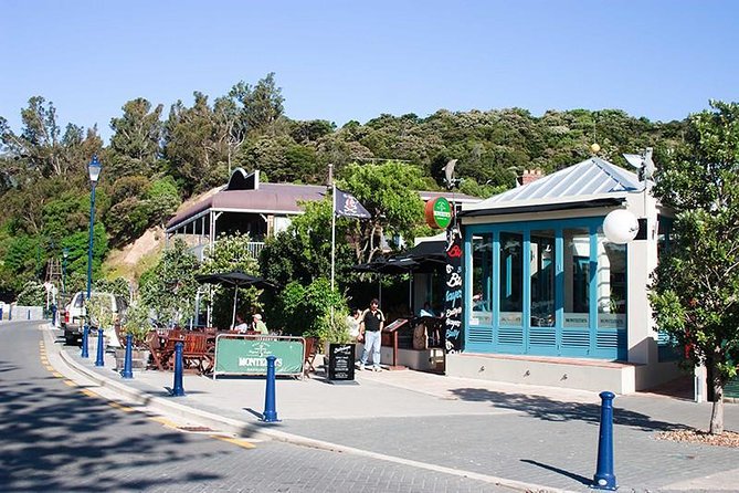 Discover Akaroa: Self Guided Audio Tour - The wooden Akaroa Lighthouse on Beach Road