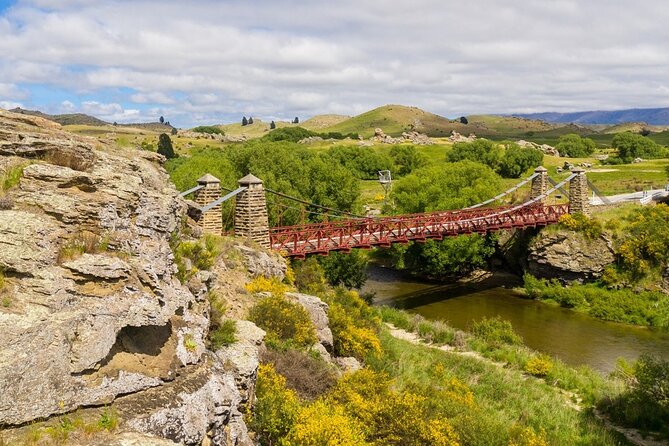 Dunedin to Queenstown One Way Tour Including Taieri Gorge Train - Changing trains for the road at Pukerangi
