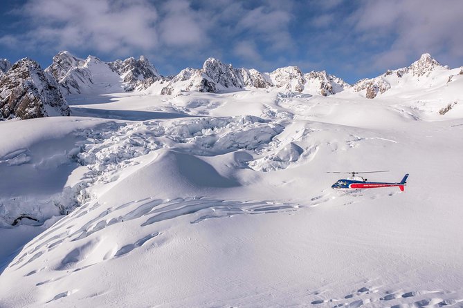 Fox Glacier: Neve Discoverer Helicopter Flight with Snow Landing - From Fox Village rainforest to glacier ice