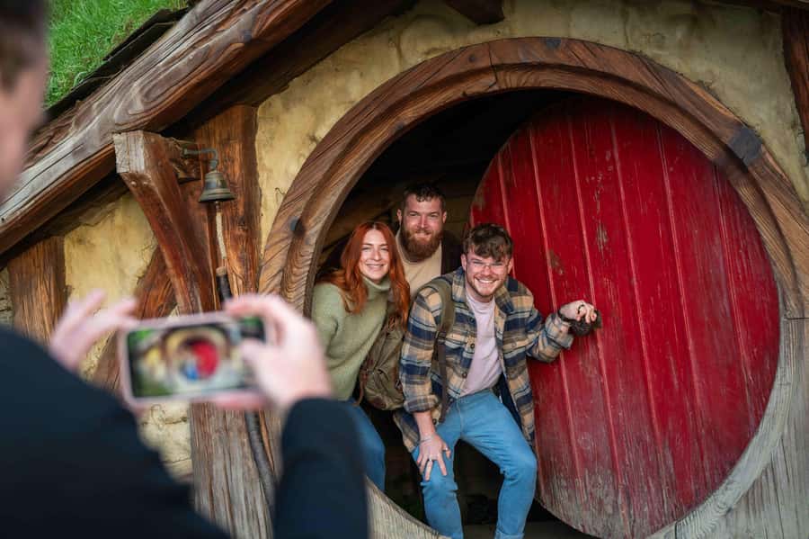 From Auckland: Hobbiton Movie Set Trip with Guided Tour - Walking through a 12-acre movie village
