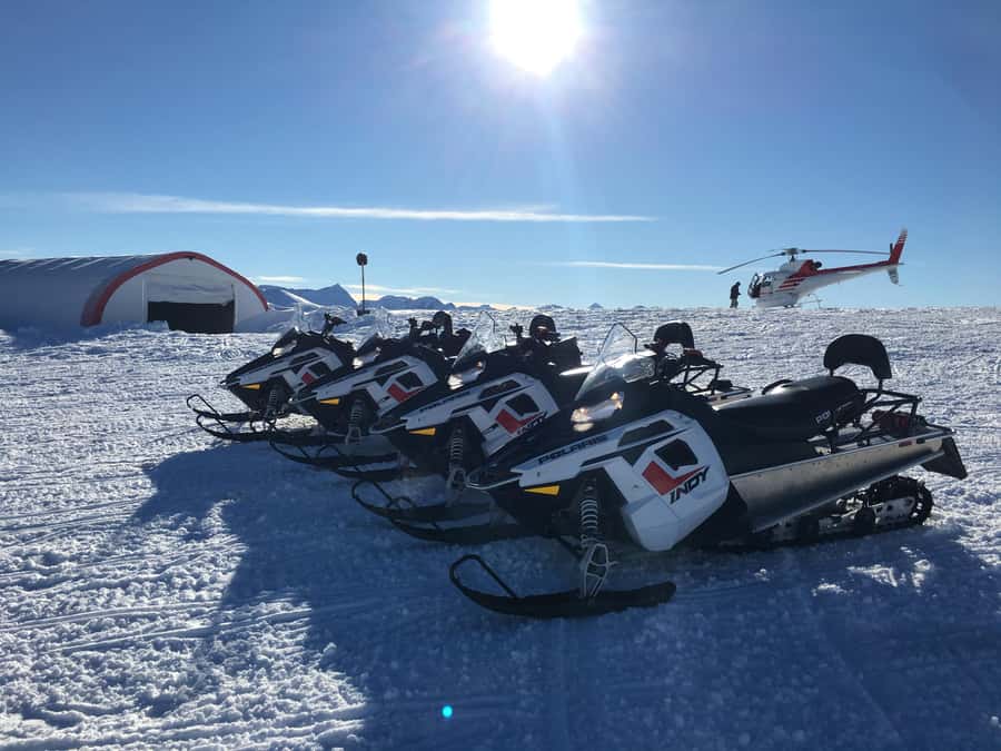 Queenstown: Snowmobiling Experience with Helicopter Flight - Landing on a snowy plateau