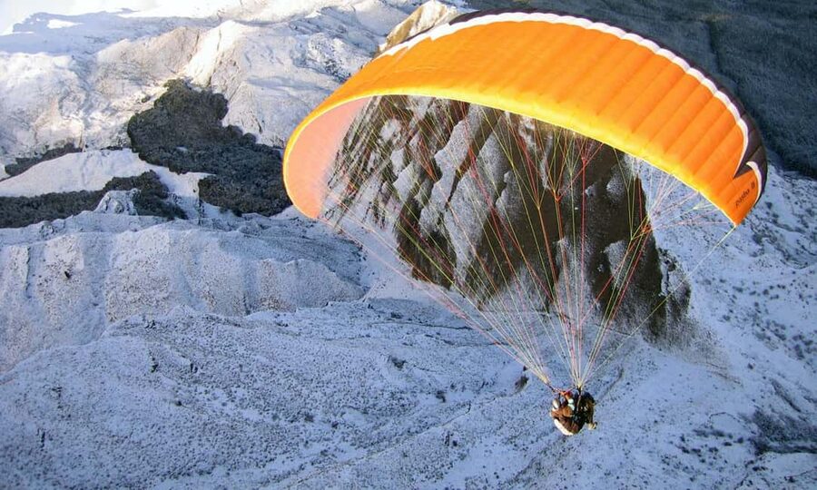 Queenstown: Tandem Paraglide - Winter - Coronet Peak 5400ft - Check-in at the SkyTrek desk in Queenstown