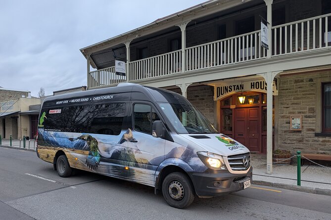 Queenstown to Dunedin with Taieri Gorge Train One-Way Tour - Changing from the road vehicle to the train at Pukerangi