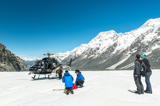 The Adventurer: Tasman Glacier Heli-hike - Following your guide across the Tasman Glacier