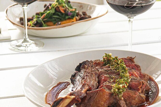 Waiheke Island Wine Tour with Scenic Vineyards & Tastings - A beach walk and wine aboard the double-decker